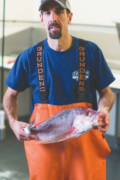Greg Bishop holds fish
