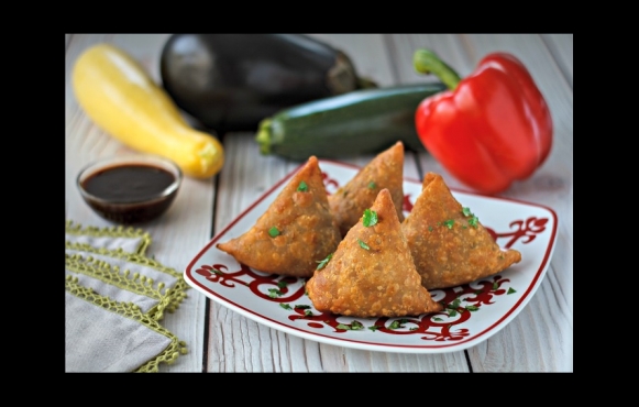 Embrace the aromatic flavors of India with this delectable recipe for samosas from the Woodstock Farmers' Market. 